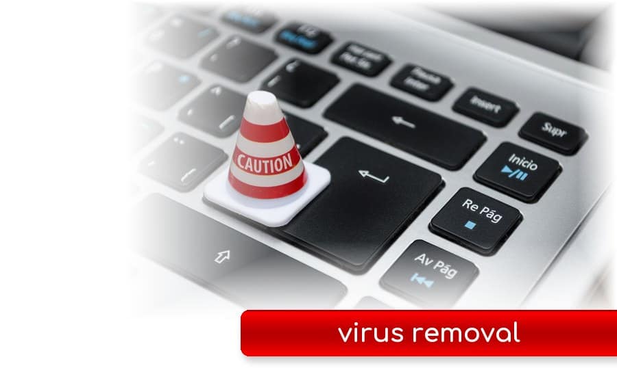 Virus removal Gold Coast Caution cone on a laptop keyboard - virus and malware removal on the Gold Coast